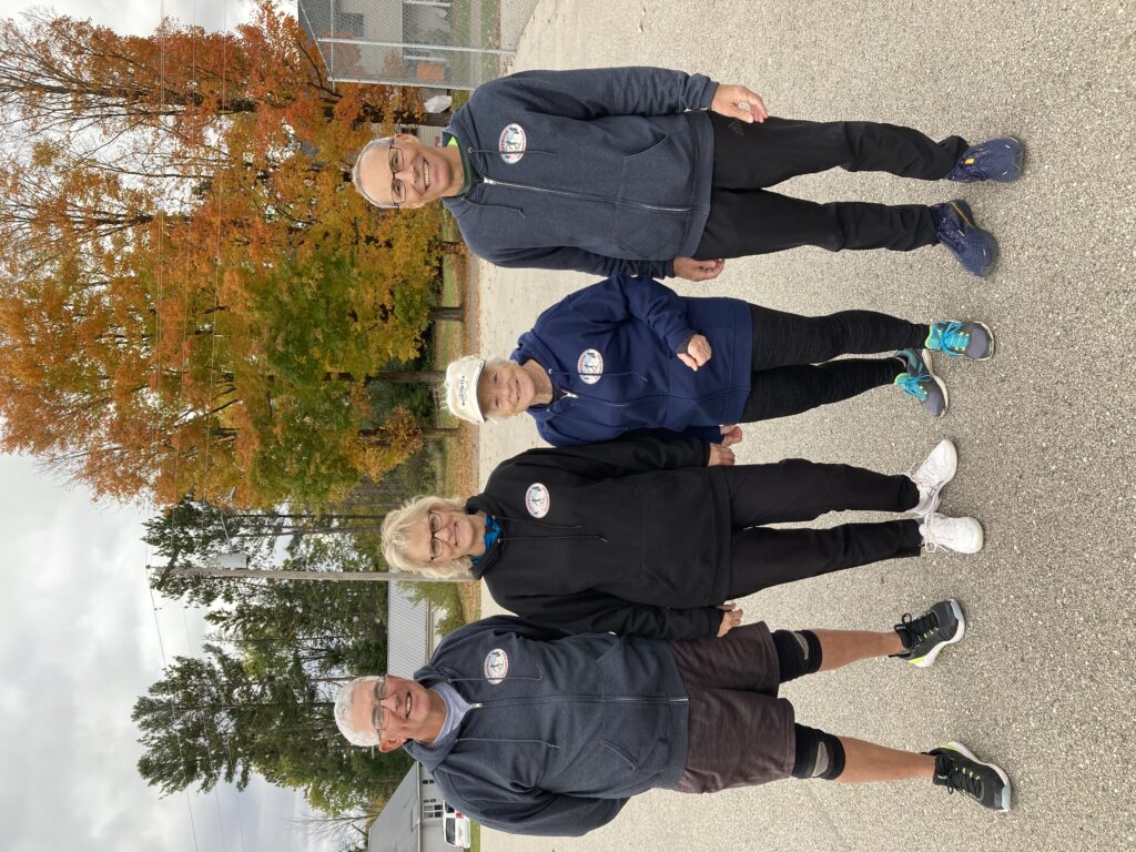 Club members modeling Lakewood XC Ski Club apparel outdoors
